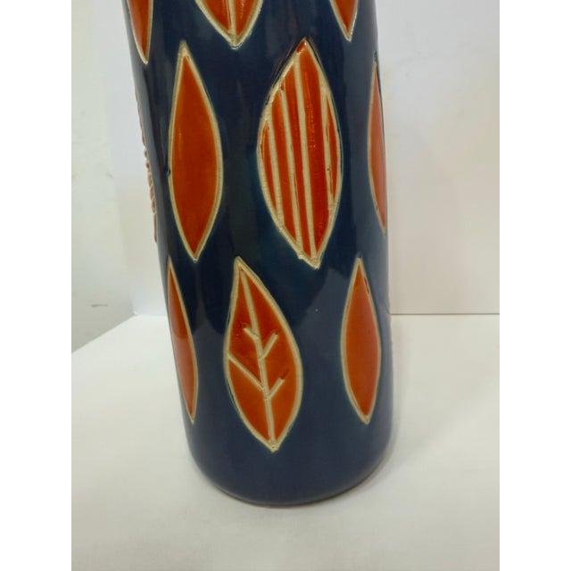 Whimsical Midcentury themed vase, bright colors playful composition.