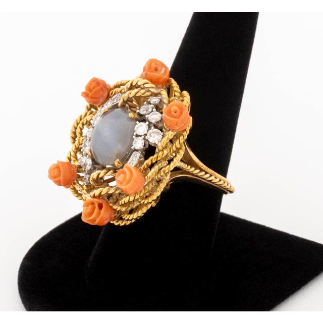 18K Rose Gold Star Sapphire Coral Diamond Ring, featuring one prong set blue star sapphire weighing approx. 7.00 carats,...