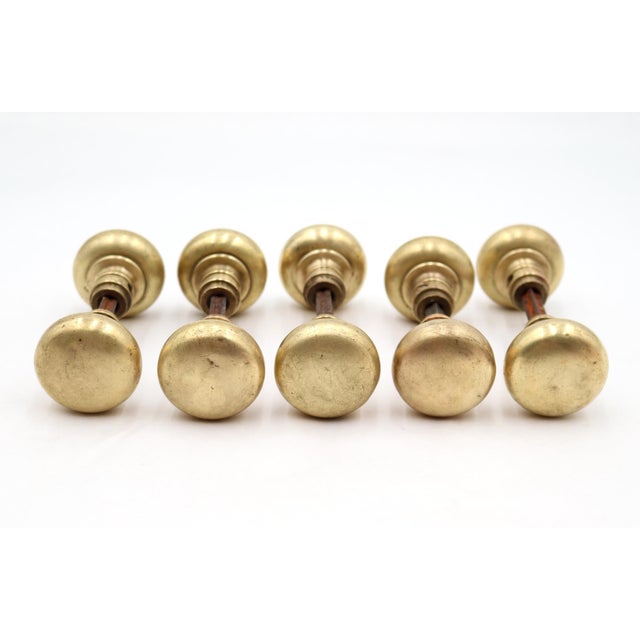 Classic style plain brass door knob house set. Good condition with surface wear from age. Each set includes two door knobs...