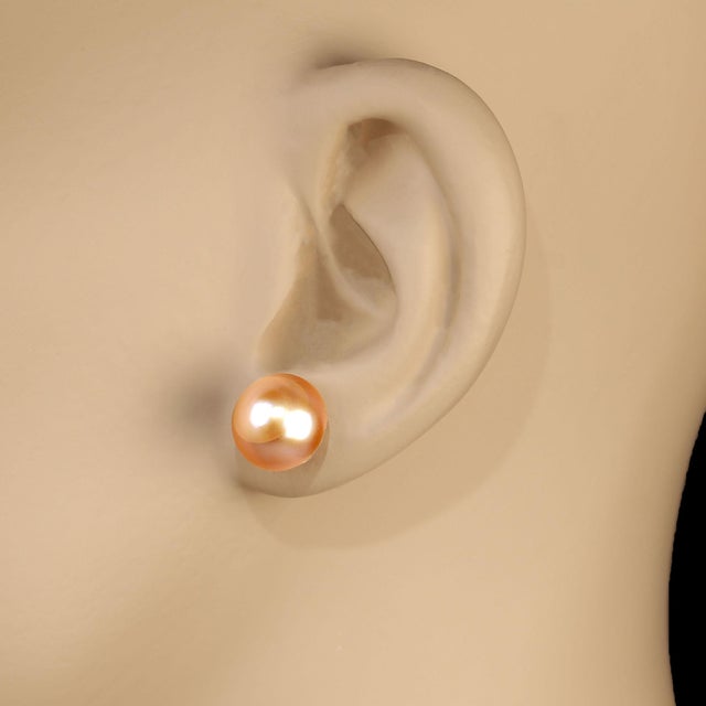 This is part of Chairish’s Fine Jewelry assortment. Classic 10mm Pearl Stud Earrings – Luxurious Iridescent Pearls with...