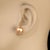 This is part of Chairish’s Fine Jewelry assortment. Classic 10mm Pearl Stud Earrings – Luxurious Iridescent Pearls with...