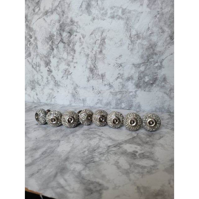 Heavy, whimsical spherical glazed pottery drawer or cabinet pulls. Excellent condition gray pottery and white glaze....