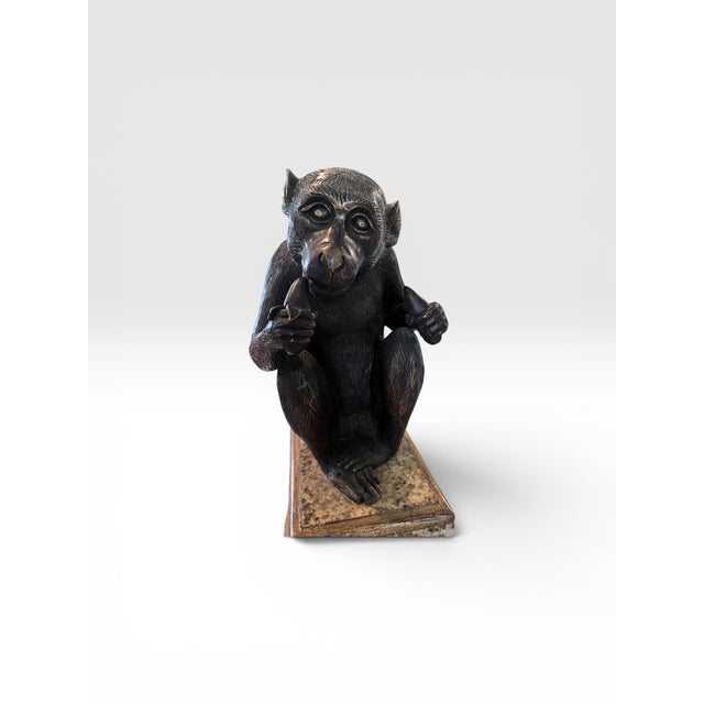 Whimsical and sophisticated, this signed Maitland-Smith bronze monkey sculpture is a superb example of the luxury...