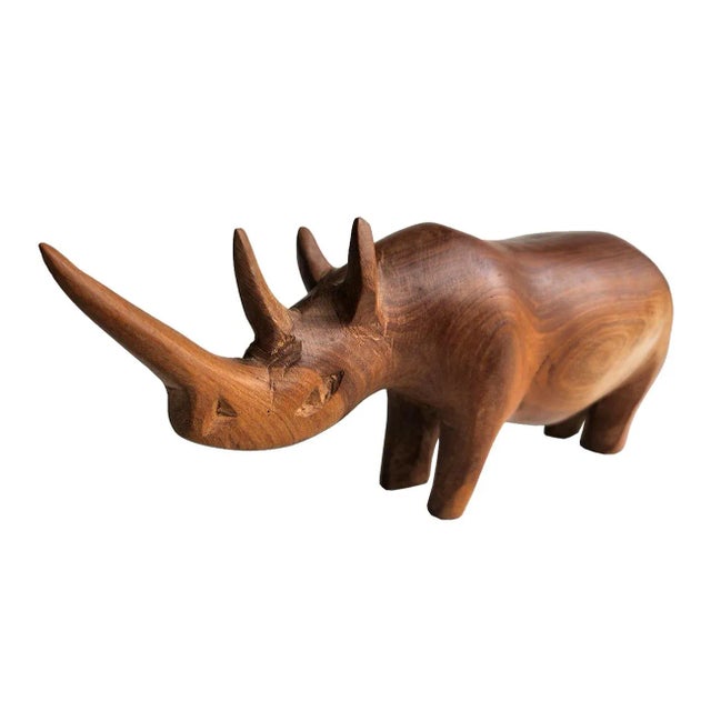 Offered is a vintage hand carved African Teak wood rhino with beautiful detail. Perfect as a paperweight, or a happy...