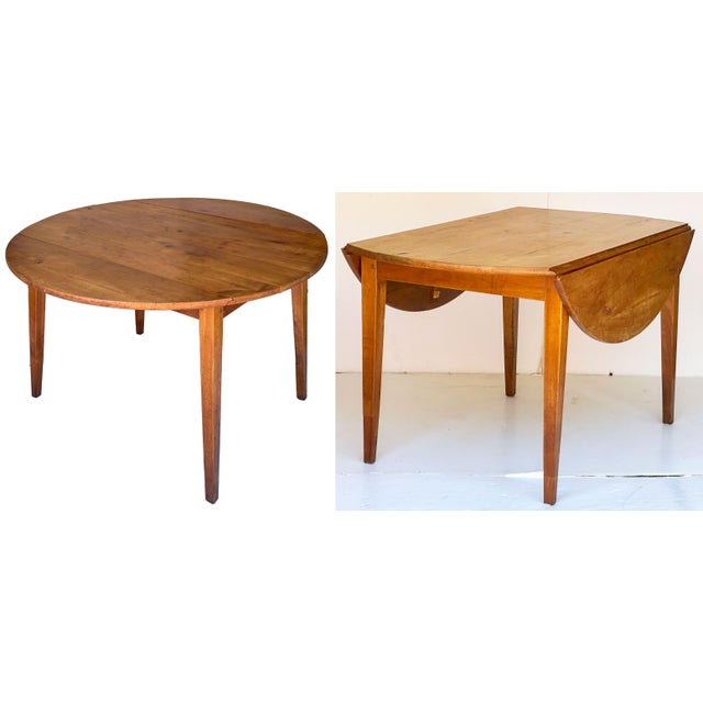 A handsome French Provincial drop-leaf table of solid cherry wood with a warm patina, featuring drop leaves that open to a...