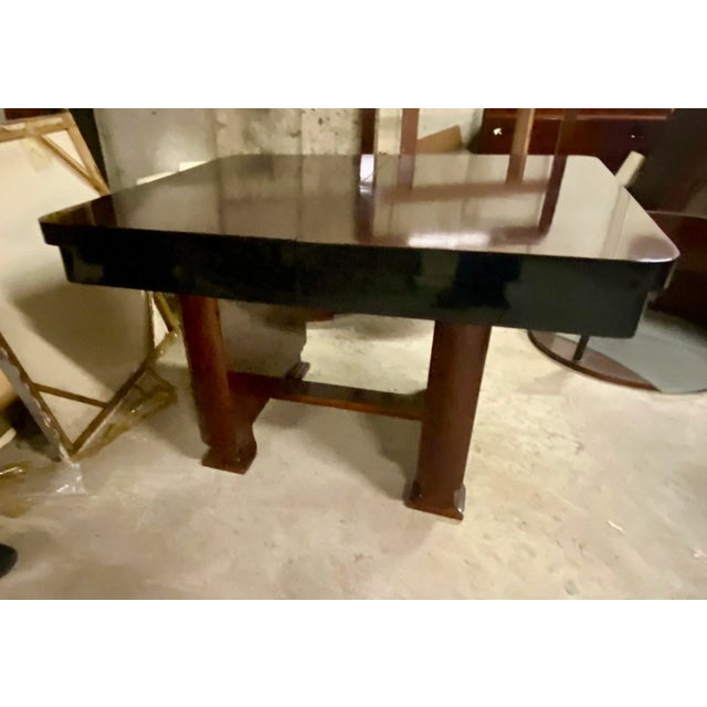 Art Deco Mahogany and Ebony Dining Table with 6.5" wide border. This table can accommodate larger gatherings by extending...