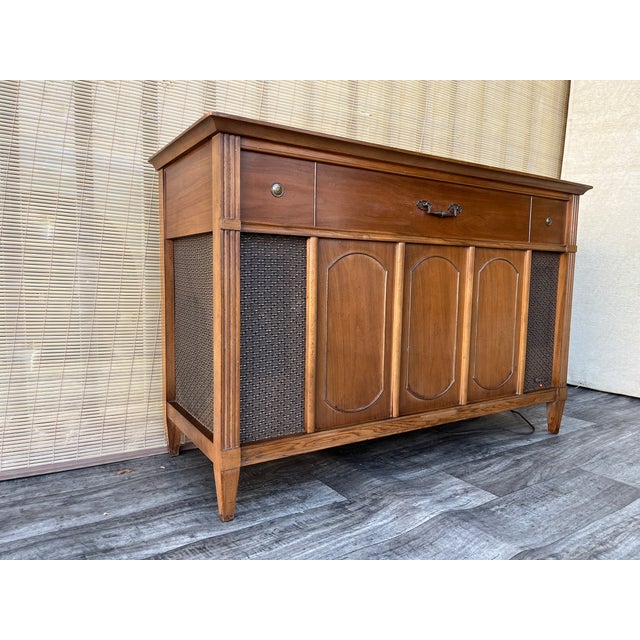 Vintage Mid Century Modern Magnavox Stereophonic Media Console High Fidelity Radio Record Player. Circa 1960s. Features a...