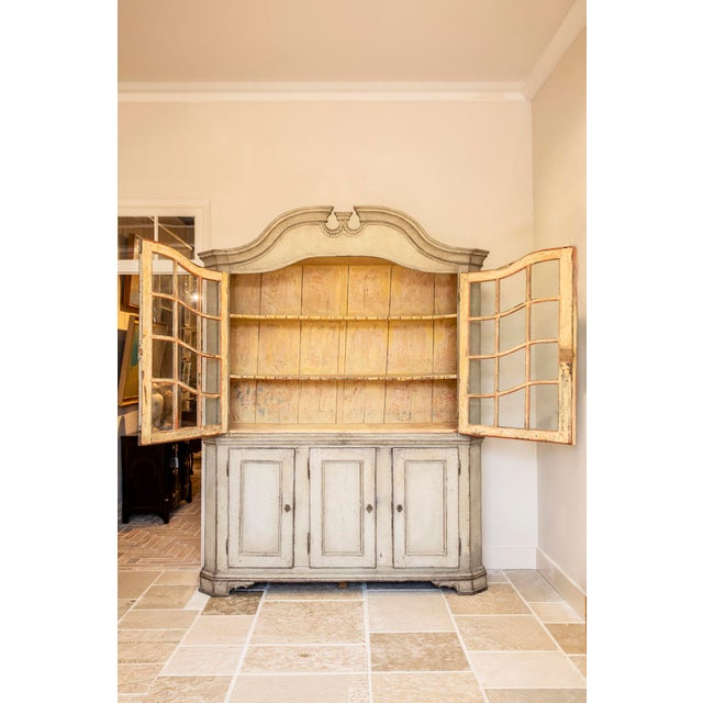 Impressive whitewashed Swedish cabinet hutch with ornate detailing and beautifully angled class panes Sweden, 19th Century...