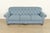An elegant and exceptionally comfortable traditional Chesterfield style sofa In the manner of Baker Furniture By Smith...