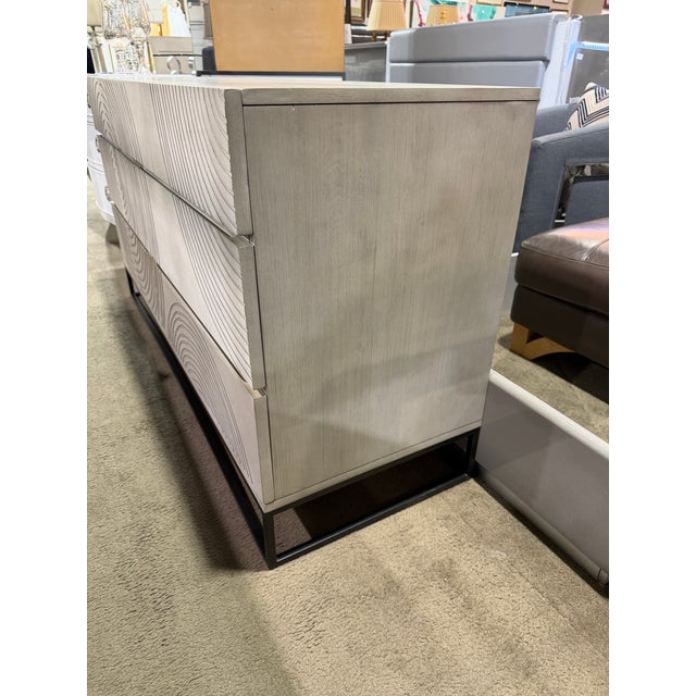 A bold statement in modern design, this Crate & Barrel “Circulus” seven-drawer dresser blends sculptural artistry with...