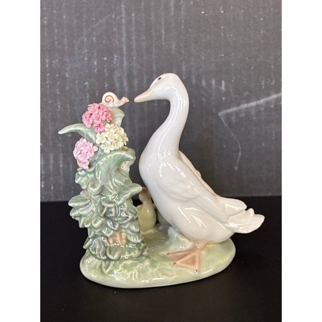 Figurative 1980s Porcelain "How Do You Do? Duck Figurine From Lladro, Featuring a Mother Duck, Three Ducklings, and a Snail on a Flowering Branch. For Sale - Image 3 of 5