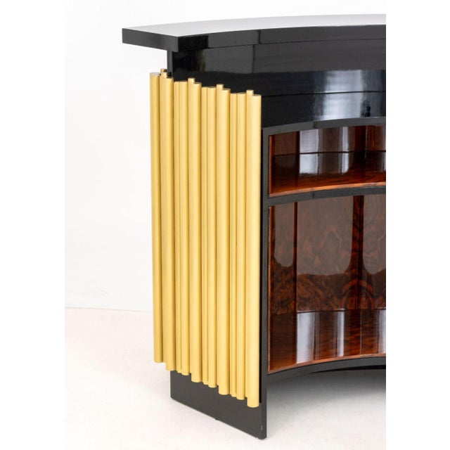 Art Deco Style Black Lacquered and Brass Freestanding Bar Cabinet, the front with tubular rods, the reverse with three...