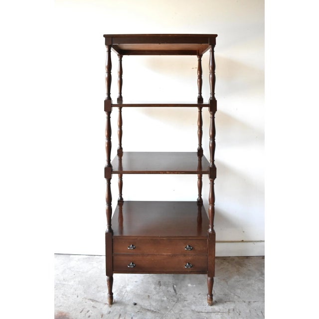 A vintage dark wood mahogany rolling etagere, whatnot, or set of 4 display shelves, in the English Regency style, with...