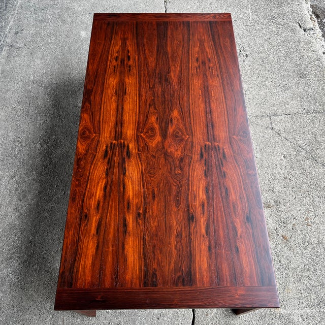 Mid-century modern rosewood coffee table by Westnofa, featuring a beautifully figured wood grain and a long, low-profile...