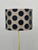 Elegant hollywood regency floor lamp produced in italy during the 1950s. This refined lighting piece features a slender...