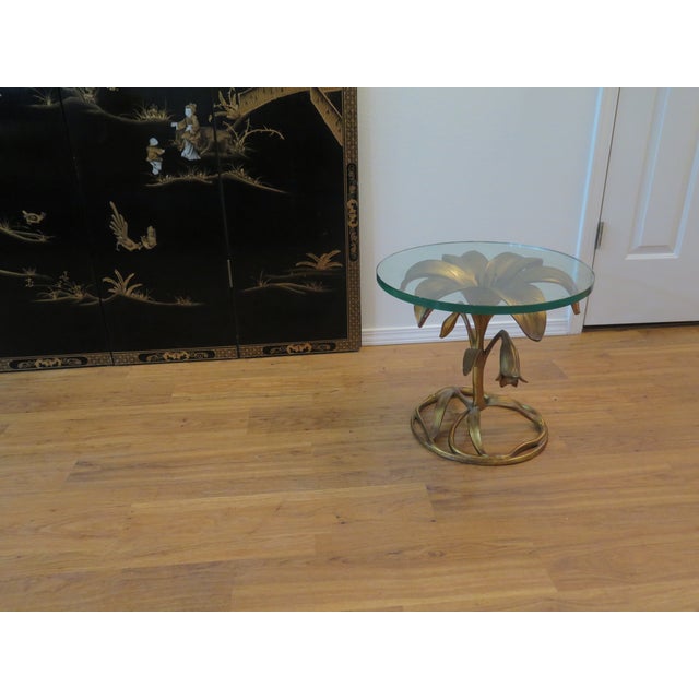 This Original Arthur Court Lily gilt side table with it's original round glass top and with the original gilt patina. This...