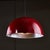 Italian, hemispherical red aluminum pendant with round holes on top and black ceiling rose, from the 1970s. The item is...