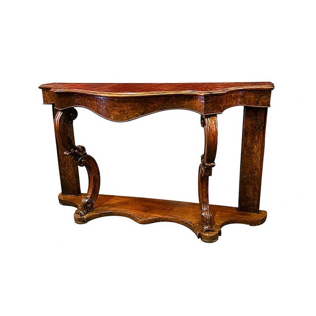 An elegant and impressive console table in wood and walnut burl, crafted in the second half of the 19th century, featuring...