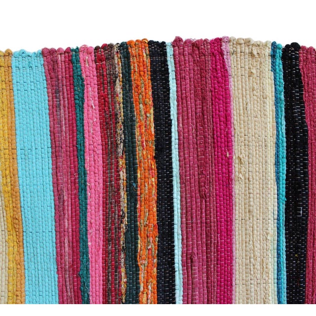 Bright and colorful striped Sari rug made from recycled cotton fabrics repurposed into fun striped rugs. Colors vary and...