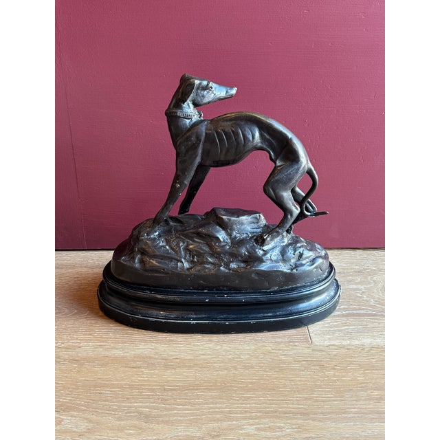 A superb large Mid-Century English bronze tone cast metal Greyhound or Whippet dog sculpture. No maker's mark. An elegant...