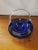This is a Cobalt Blue Hand Blown Glass Basket, Made in Romania. It measures 6" high, 7 1/2" long and 5 3/4" deep. The...