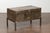 An English metal trunk from the early 20th century, on custom stand. Created in England during the first quarter of the...