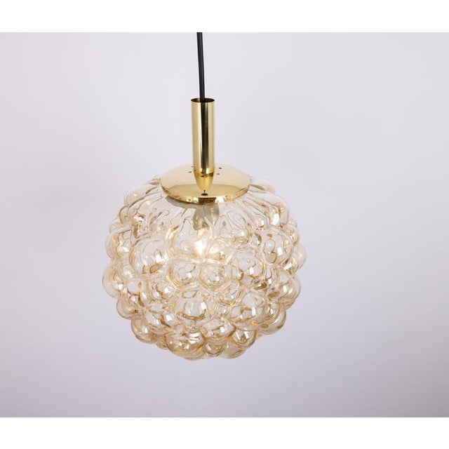 A round bubble glass pendant with light smoke tone designed by helena tynell for limburg, manufactured in germany, circa...