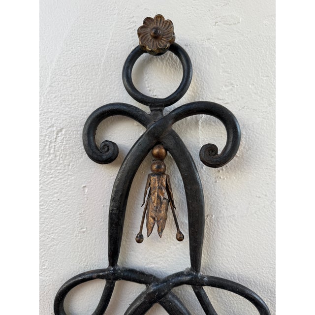 This pair of iron wall lights have some age and beautiful patina. They are hardwired and can be used indoors or outdoors...