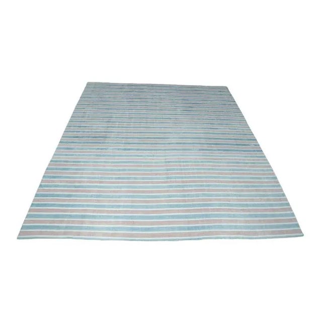 This 9x12 vintage Dhurrie rug is an exciting new curation from Rug & Kilim’s latest acquisition of rare and exemplary mid-...