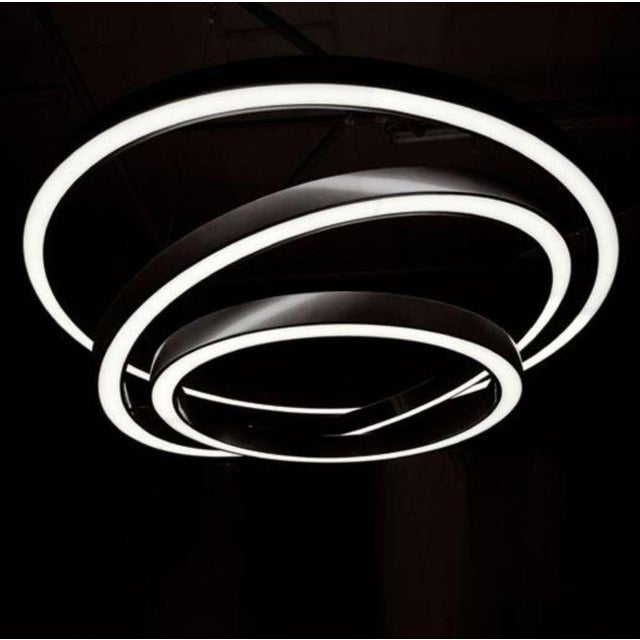 Infinito triple ring pendant led in satin stainless steel by aggiolight. Dimensions: d 120 x h 80 cm. Materials: premium...