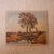 This 20th century French far away farmhouse painting captures the quiet beauty of the countryside with a soft, pastoral...