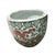 A vintage pair of Chinese export porcelain jardinieres with a dragon motif circling each planter. Coral and pink dragon is...