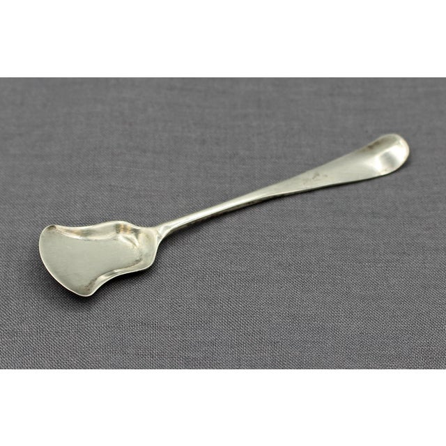 Sterling silver salt spoon, London, 1715, Hanoverian pattern. George I period. Obverse monogram: WSH. Typically distorted...