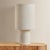 The all-over soft ivory boucle of the Sam family of lamps creates an inviting addition to modern interiors. As a table...
