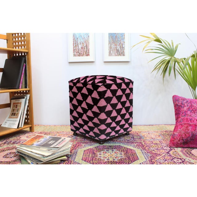 This chic handmade ottoman is crafted from wood and upholstered with a hand-woven kilim wool rug. It serves as a versatile...