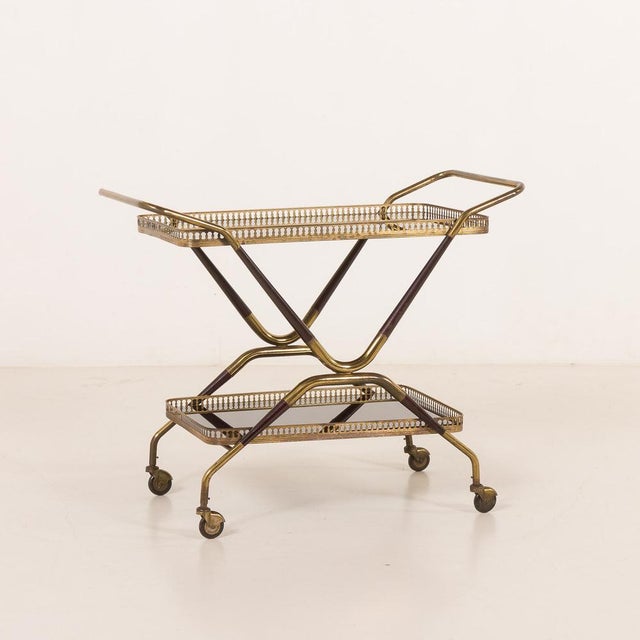An elegant italian mid-century brass bar cart comes from the 1960s. overall cart size is h: 72 / w: 84 / d: 42 cm. the...