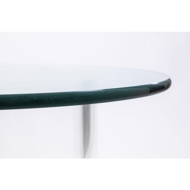 A vintage Vladimir Kagan style snail side table. This vintage side table features a fun Kagan style design with its...