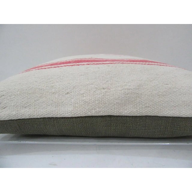 This is a pillow cover made from a vintage kilim rug. The piece was properly washed and ready to use. Pillow inserts not...