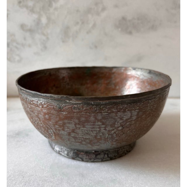 Vintage hand carved copper bowl made in Iran and marked on the bottom. Beautiful detail and rich patina.