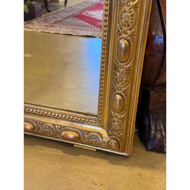 This 19th Century French mirror is top of its class! With its stunning gilded adornments such as its hand carved edging,...