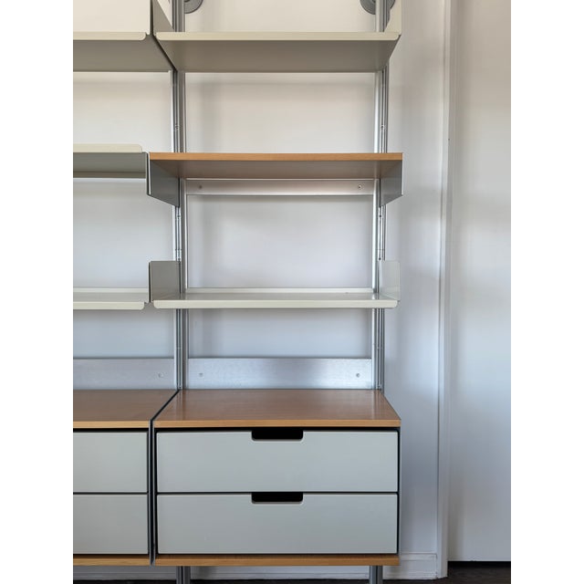 Designed by the iconic Dieter Rams, this Vitsoe Shelving is in near-perfect condition. Grey & wood cabinetry, with steel...