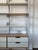 Designed by the iconic Dieter Rams, this Vitsoe Shelving is in near-perfect condition. Grey & wood cabinetry, with steel...
