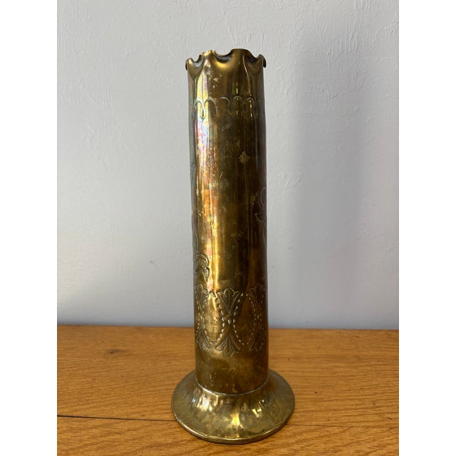 This captivating vintage English brass trench art vase carries both history and artistry in equal measure. Its surface is...