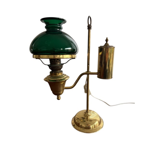 Vintage brass desk lamp with integrated pen holder in classic English banker style. Elegant and functional piece with...