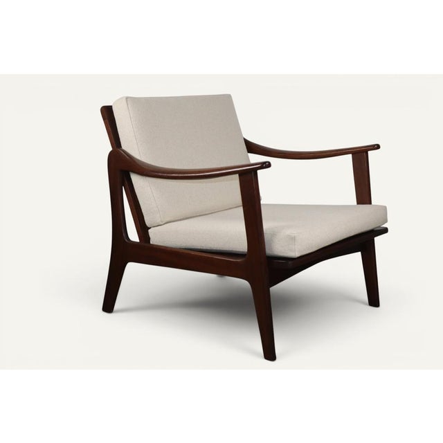Elegant Scandinavian lounge chair from the 1960s, crafted from solid teak with organic lines particularly representative...