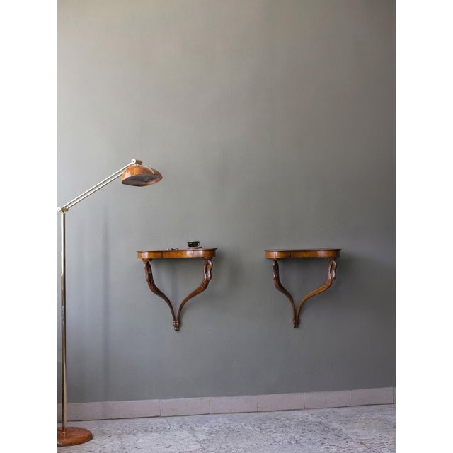 The set of two elegant wall - mounted consoles tables perfect in entryway or as bedside tables. Curved supports are finely...