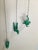 Offered is a three-piece wall-mount sculpture of men climbing a rope. Crafted from resin in a rich green color. Looks...