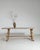 A distinctive French dining table featuring a harp-style base, showcasing curved wooden supports that add sculptural...