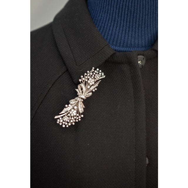 1950s platinum diamond duette pin brooch set with 152 round brilliant cut and 24 baguette cut diamonds approximate 7.06...