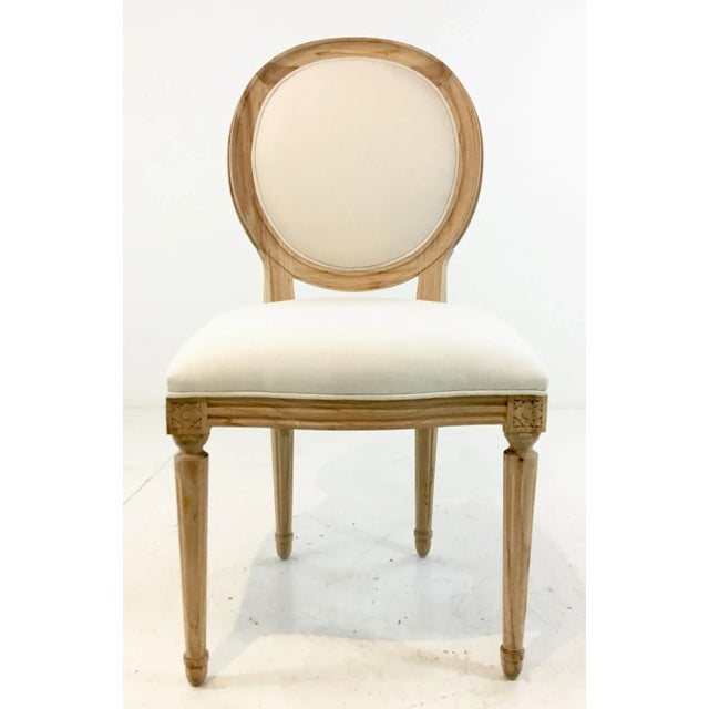 Elegant Ave Home Transitional French Style Octavia Side Chair, blonde wood frame with white fabric, flouted legs, showroom...